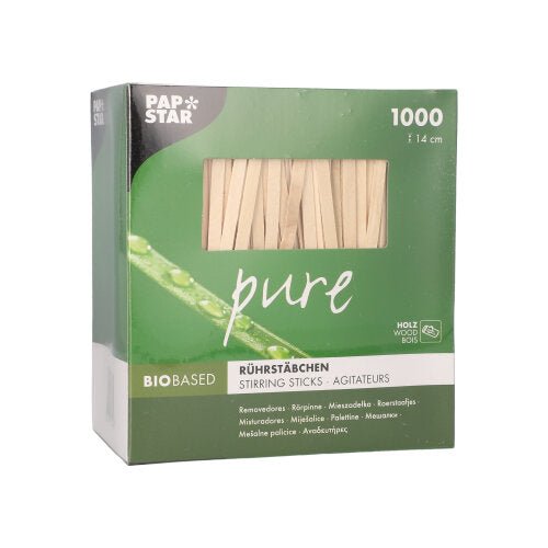Zeleno-biela krabica „pure“ obsahuje 1000 miešacích paličiek bez triesok, 14 cm dlhých, z biobázového brezového dreva spoločnosti PAPSTAR GmbH. Názov značky sa objavuje vľavo hore na obale.