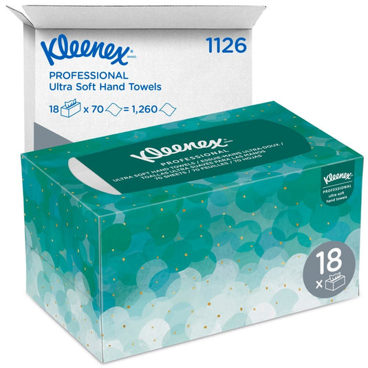 Na obrázku je krabička vreckoviek Kleenex® Ultra™ Interfold (biele, stredné, 70 kusov) od spoločnosti Kimberly-Clark GmbH pred bielou prepravnou krabicou s nápisom „1126“ a „18 x 70 = 1 260“, v ktorej sa nachádza 18 hygienických balení.