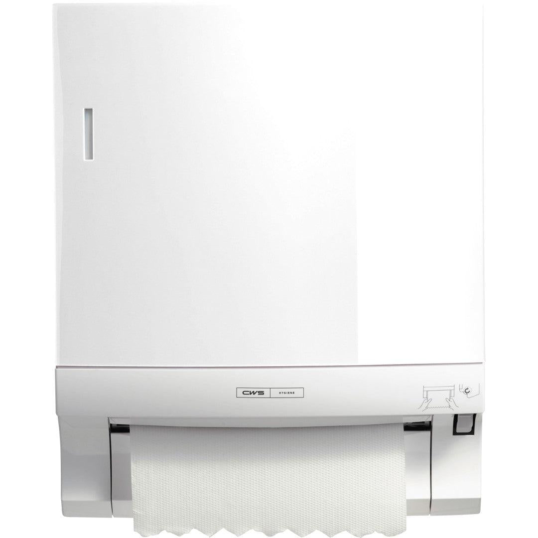 Na stene je namontovaný CWS ParadiseLine držiak na papierové uteráky Paperroll (Biela, 1 ks). Papierová páska visí von, úzke priehľadné okienko a ikona vpravo dole predstavujú hygienické sušenie rúk.