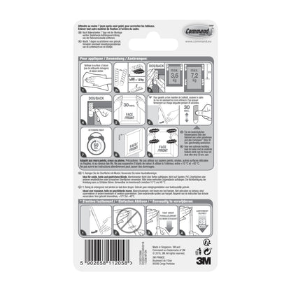 Die Rückseite der Packung 3M Deutschland GmbH Große Command™ Bilder-Montage Strips L, 6 Sets im Vorteilspack (17206-6) zeigt eine bebilderte Schritt-für-Schritt-Anleitung zum Aufhängen, eine mehrsprachige Anleitung und einen Barcode am unteren Rand.