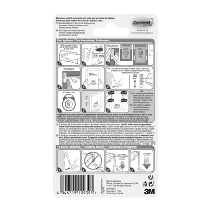 Die Rückseite der 3M Deutschland GmbH Kleine weiße Command™ Bilder-Montage Strips S 17202 Verpackung zeigt bebilderte Montage- und Entfernungshinweise, Sicherheitswarnungen, Produktinfos, Barcode und Firmendetails in mehreren Sprachen.