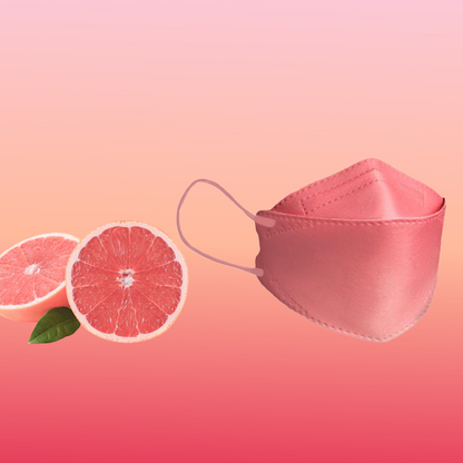 Dizajnérska maska na tvár Altruan s filtrom na častice (štandard FFP2) je elegantne umiestnená vedľa dvoch polovíc grapefruitu na ružovom pozadí s farebným prechodom, čo zdôrazňuje jej štýlový dizajn a ergonomické prispôsobenie.