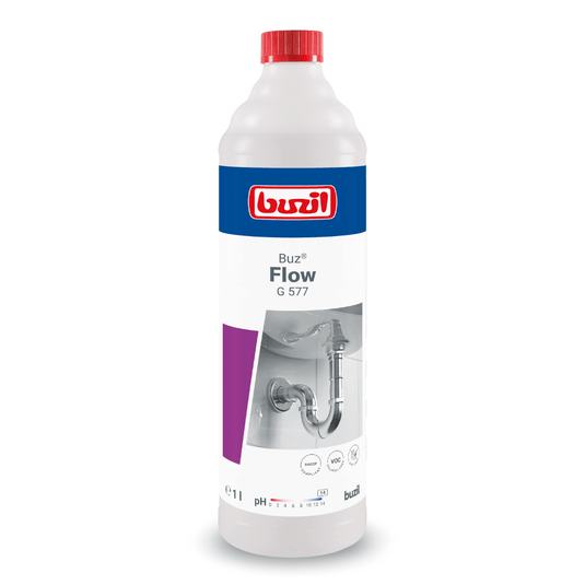 1-litrová fľaša tekutého čističa potrubia Buzil Buz® Flow G 577, vyrobená spoločnosťou BUZIL-WERK Wagner GmbH & Co. KG. Na etikete je vyobrazená sanitárna grafika a logo výrobku. Fľaša, ktorá je prevažne biela, je zdobená červenými, modrými a fialovými detailmi a je vybavená červeným uzáverom, ktorý slúži na účinné odstraňovanie upchávok v odtokoch.