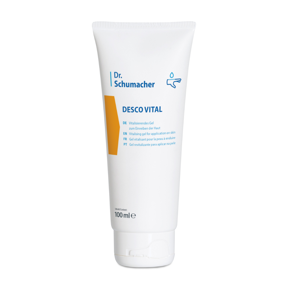 Biela 100 ml tuba s nápisom „Dr. Schumacher Desco Vital Hydro Gel“ od Dr. Schumacher GmbH. Na tube sa nachádza viacjazyčný text, ktorý uvádza, že ide o revitalizačný hydrogel na použitie na pokožku. Dizajn zahŕňa žlto-oranžový akcent a jednoduchý symbol kvapky, čo ho robí ideálnym pre športovú masáž.