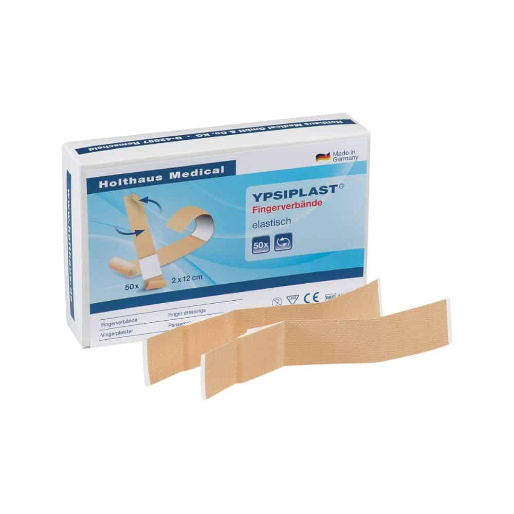 Vystavená je škatuľa Holthaus Medical YPSIPLAST® prsta, elastická od Holthaus Medical GmbH & Co. KG, ktorá obsahuje 50 elastických obväzov s rozmermi 2 cm x 12 cm. Pred škatuľou sú umiestnené dva elastické obväzy na prsty. Na obale je hrdý nápis „Vyrobené v Nemecku“.