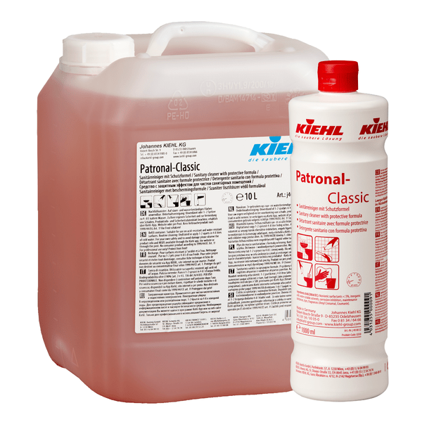 Dva balenia Kiehl Patronal-Classic Sanitárneho čističa s ochrannou formulou od Johannes Kiehl KG - jeden 10L kanister a jedna 1L fľaša, obidva s bielou etiketou a červeným písmom; s biologicky odbúrateľnou receptúrou.