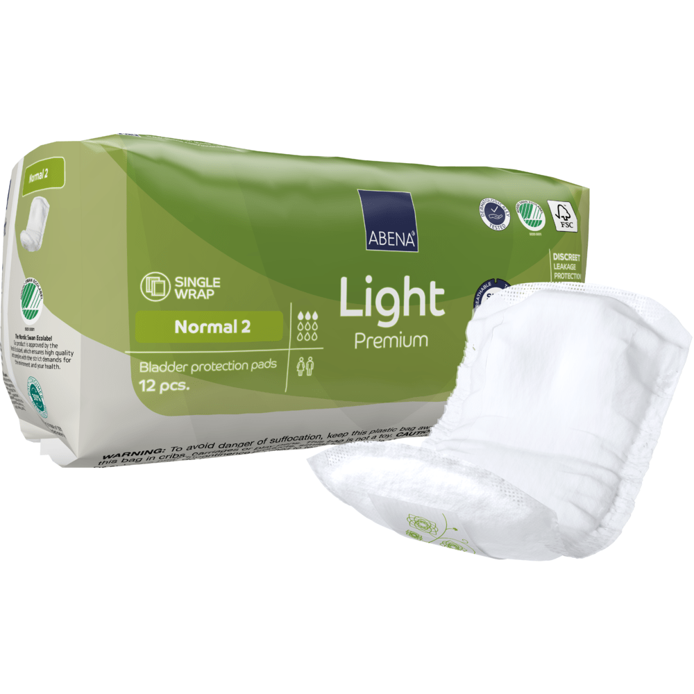 Zeleno-biele balenie ABENA Light Normal 2, Premium | Balenie (12 kusov) od spoločnosti Abena Re-Seller GmbH stojí vedľa nerozloženého vložky. Balenie zobrazuje detaily produktu, symboly a zdôrazňuje savosť.