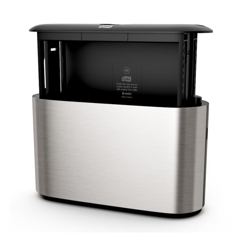Predstavujeme Tork Xpress® 460005 stolný dávkovač, štýlový automatický dávkovač z nehrdzavejúcej ocele s moderným dizajnom, ideálny pre skladané papierové utierky. Tento produkt od TORK – Essity Professional Hygiene Germany GmbH má čierny vrch so senzorom viditeľným v strede a bočnými otvormi pre jednoduché podávanie utierok.
