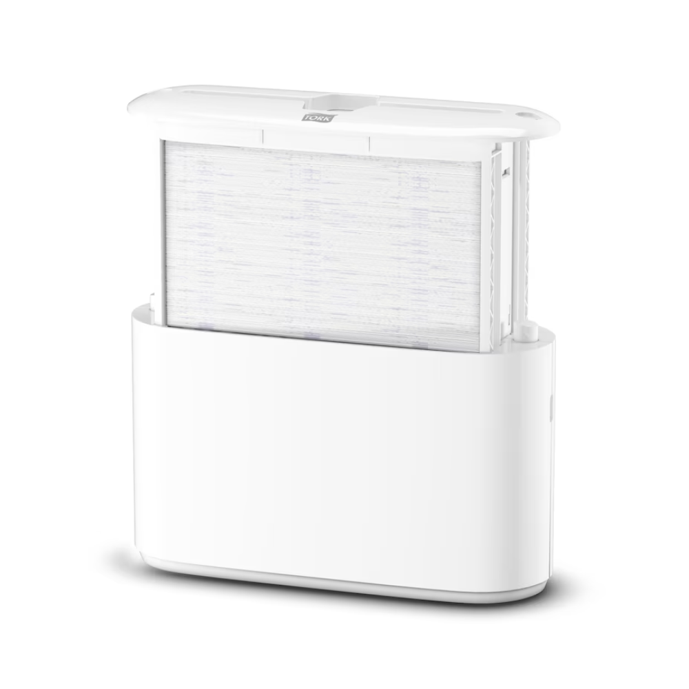 Stolový zásobník Tork Xpress® 552200 pre skladané uteráky Elevation H2 od TORK - Essity Professional Hygiene Germany GmbH zaujme štíhlym, minimalistickým dizajnom s viditeľným filtrom integrovaným do podstavca. Vertikálne umiestnený filter zlepšuje celkovú estetiku a vrch je mierne otvorený, aby demonštroval jeho efektívnu funkčnosť.