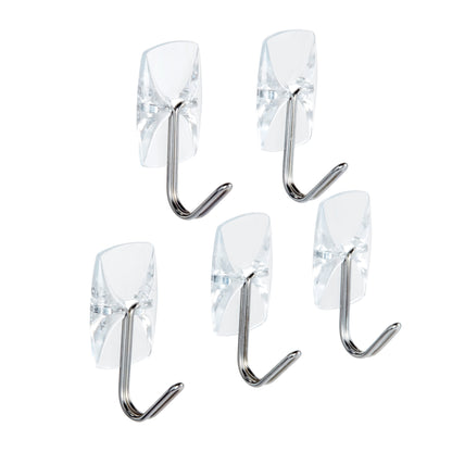 Fünf Command™ Drahthaken, klein, transparent, mit transparenten Strips von 3M Deutschland GmbH sind auf weißem Hintergrund verstreut und zeigen ihr klares rechteckiges Design und die silbernen Drahthaken.