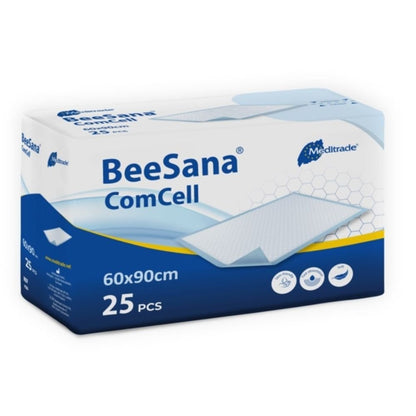 Obrázok zobrazuje obdĺžnikovité balenie podložky BeeSana® ComCell od spoločnosti Meditrade GmbH. Bielo-modrá krabica meria 60x90 cm, obsahuje 25 kusov a je vyrobená z vysoko savého celulózového papiera.